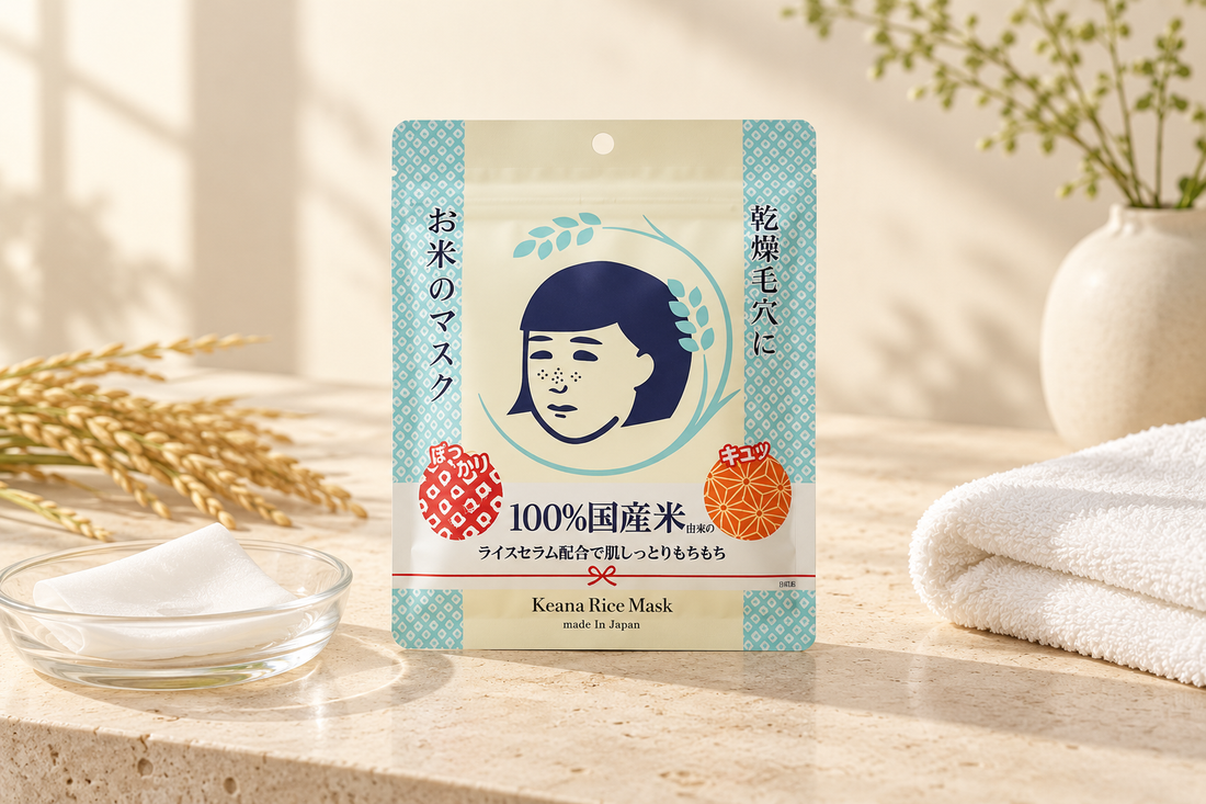 Keana Nadeshiko Rice Mask pouch on a warm minimalist vanity with a folded sheet mask and white towel