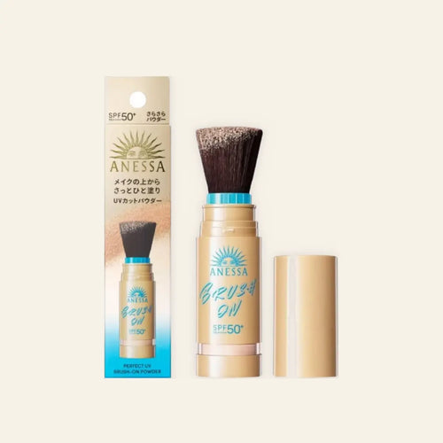 Anessa Perfect UV Brush On Powder Sunscreen on a warm ivory background