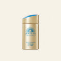 Anessa Perfect UV Sunscreen Skincare Milk SPF 50+ on a warm ivory background