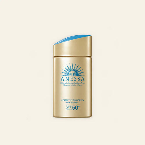Anessa Perfect UV Sunscreen Skincare Milk SPF 50+ on a warm ivory background
